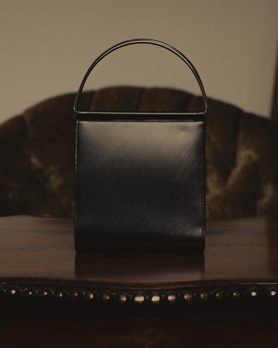 "Cartier" 80's Sculptural ring-handle leather wallet