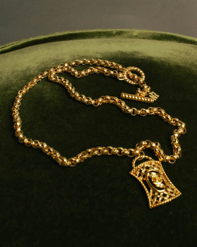 “NINA RICCI” Late 80’s-90’s gold tone openwork pendant necklace