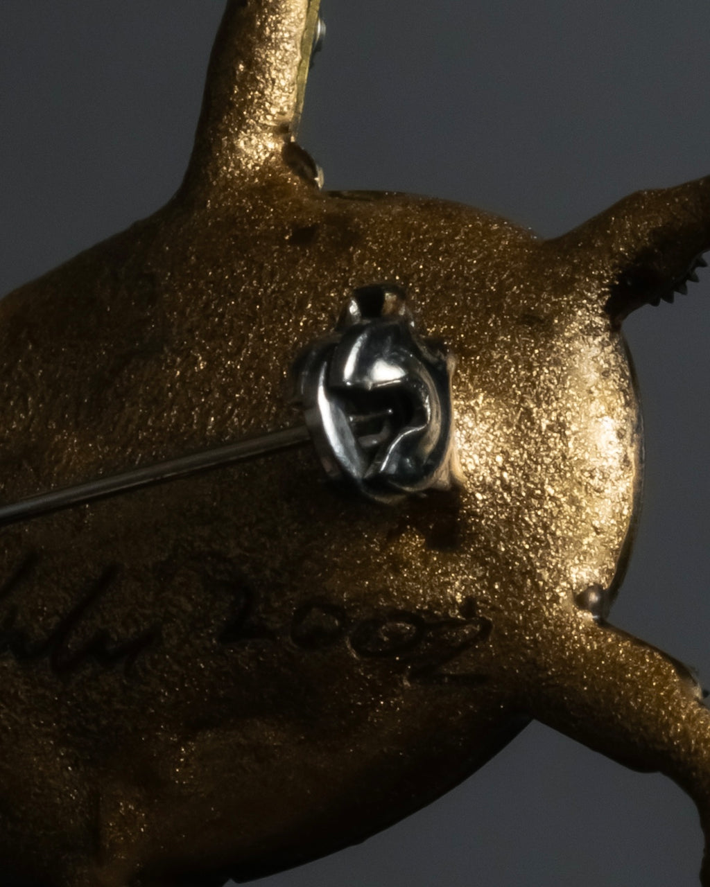 "Jerry Robertson design clock motif brooch"