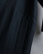 Tight-waisted wool shirt and black coat