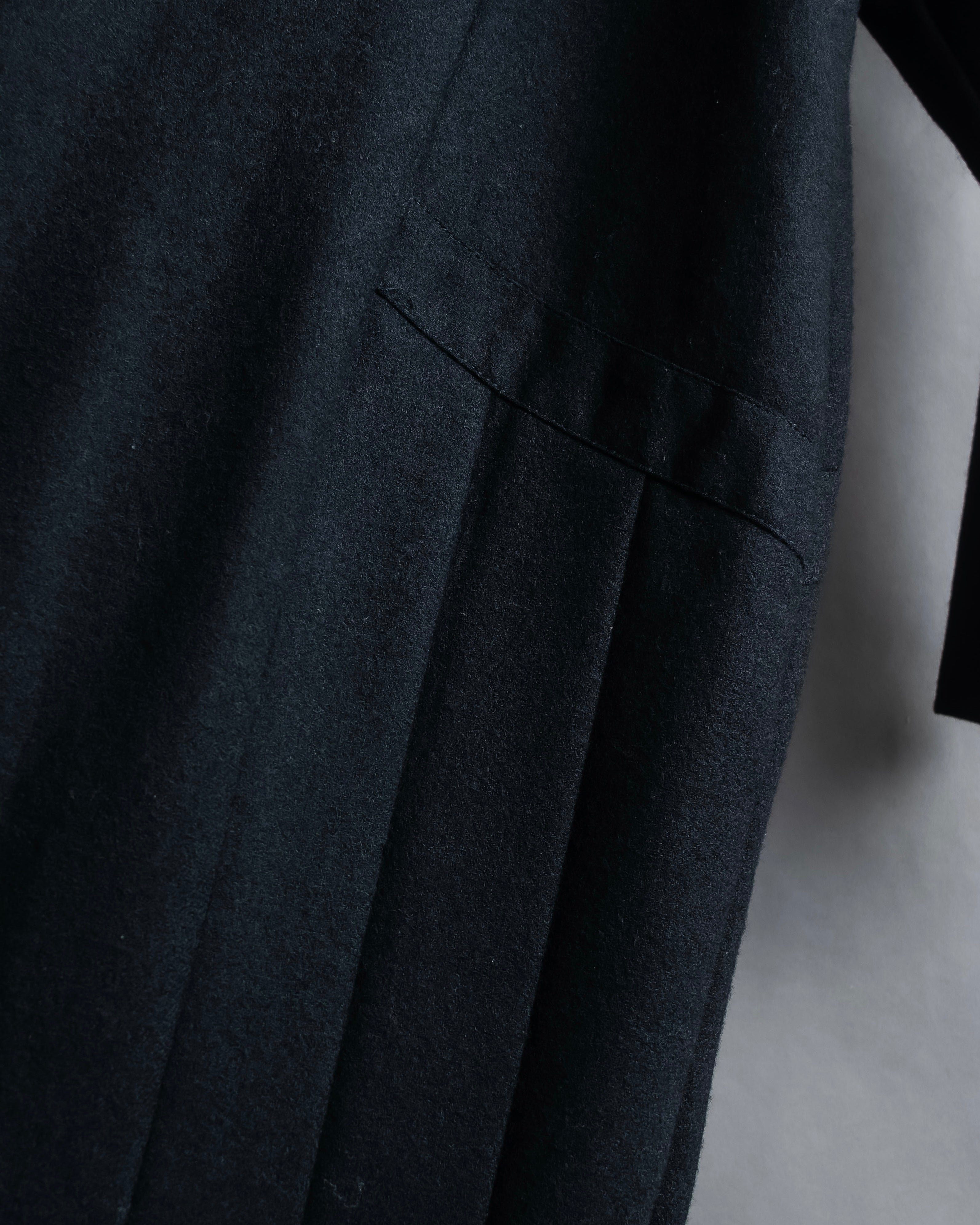 Tight-waisted wool shirt and black coat