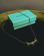 "Tiffany & Co." 80's-90's Sculptural triple bow necklace