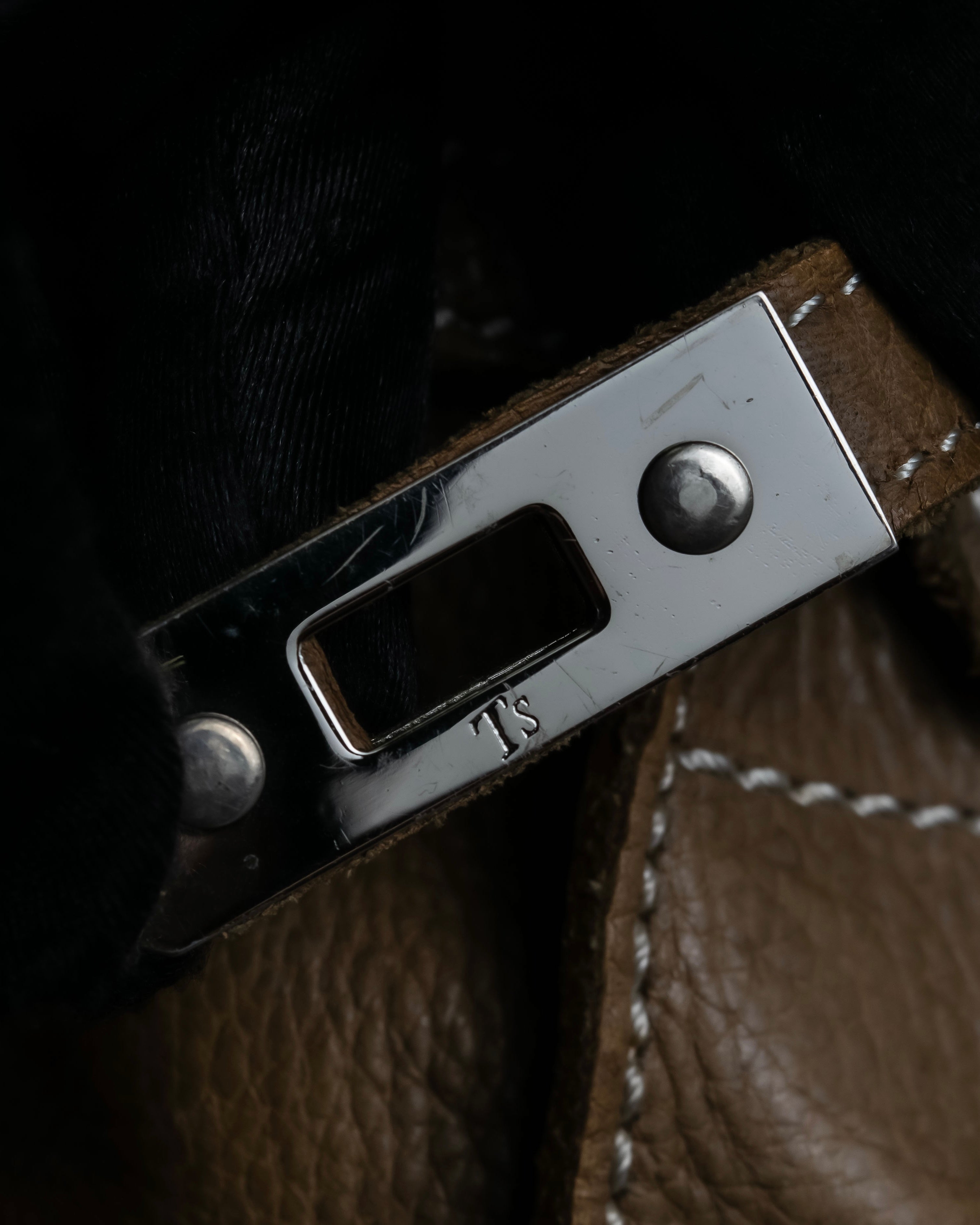 "Mademoiselle Accessories"
 Silver parts design leather one handle bag