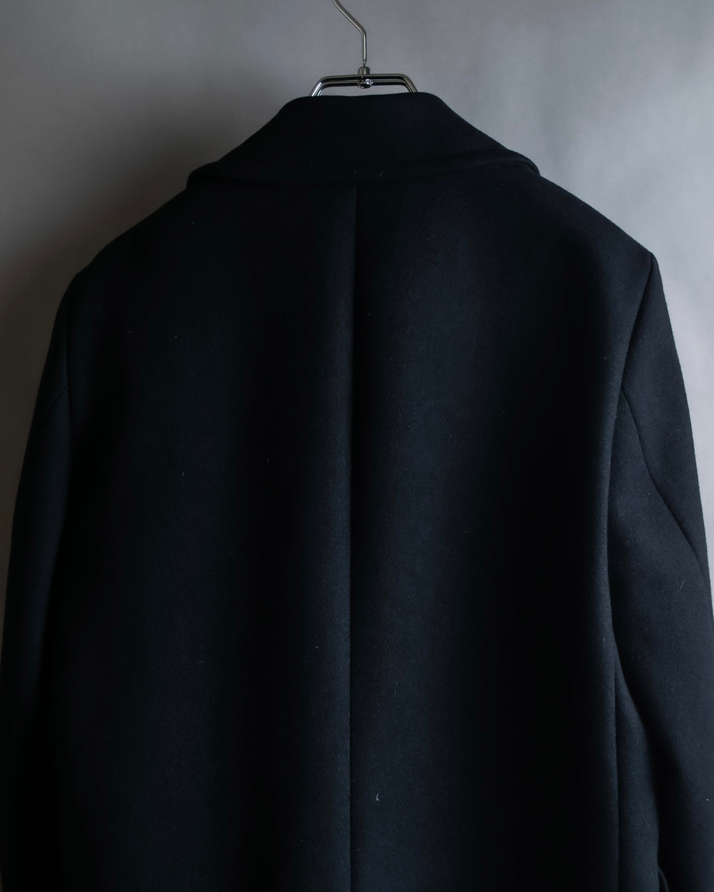 "JOHN LAWRENCE SULLIVAN"
 Large lapel double-breasted mid length coat