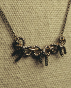 "Tiffany & Co." 80's-90's Sculptural triple bow necklace