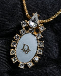 "Christian Dior" Trotter logo engraved gold pendan