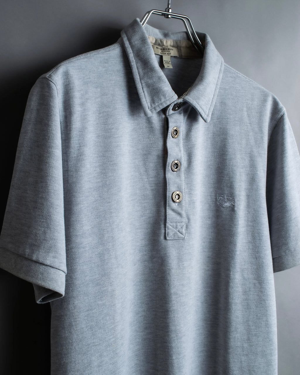 "BURBERRY" Knight logo engraved metal button polo shirt