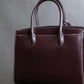 "HAMANO TOKYO" Trapezoidal shape iconic hardware leather one handle bag