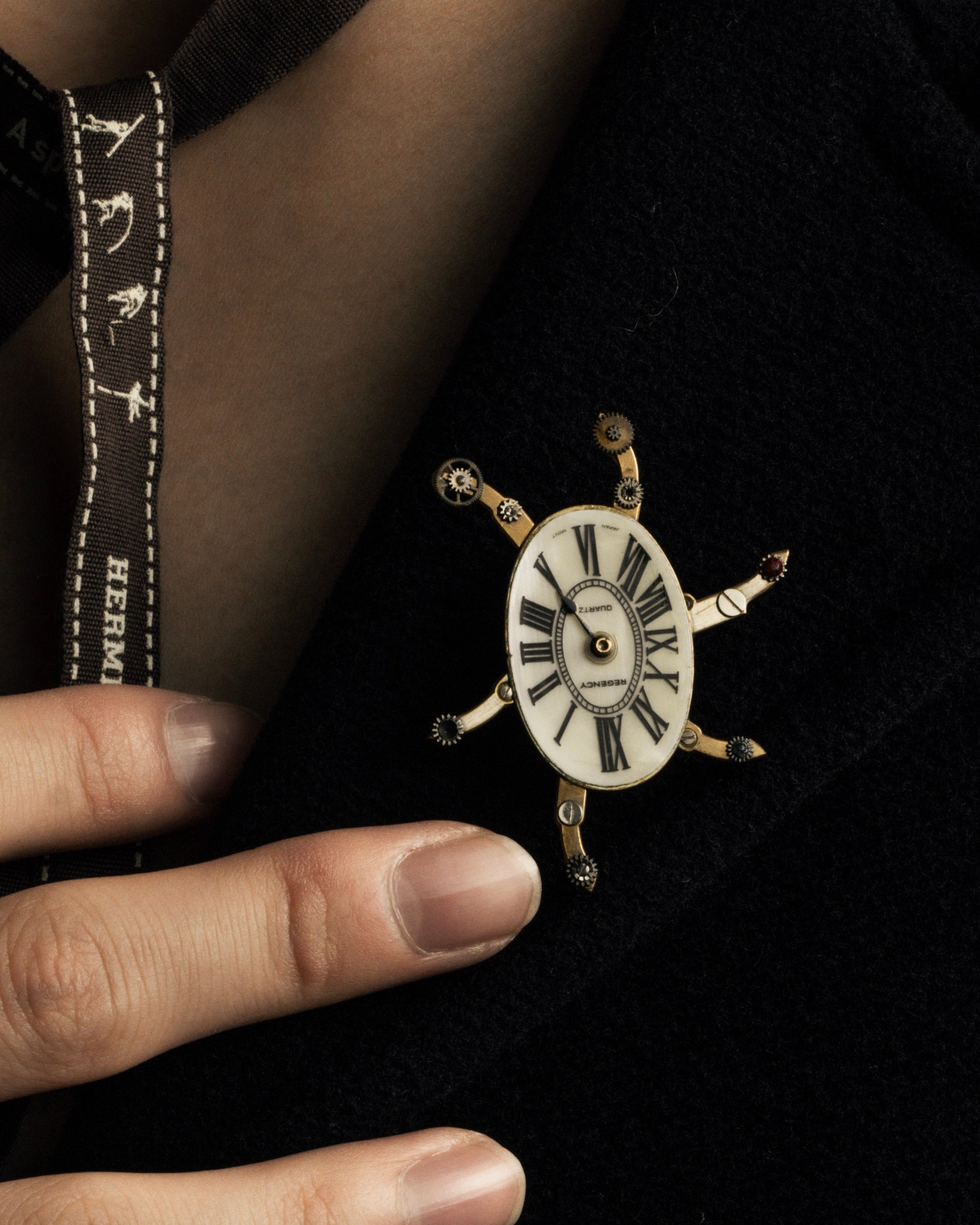 "Jerry Robertson design clock motif brooch"