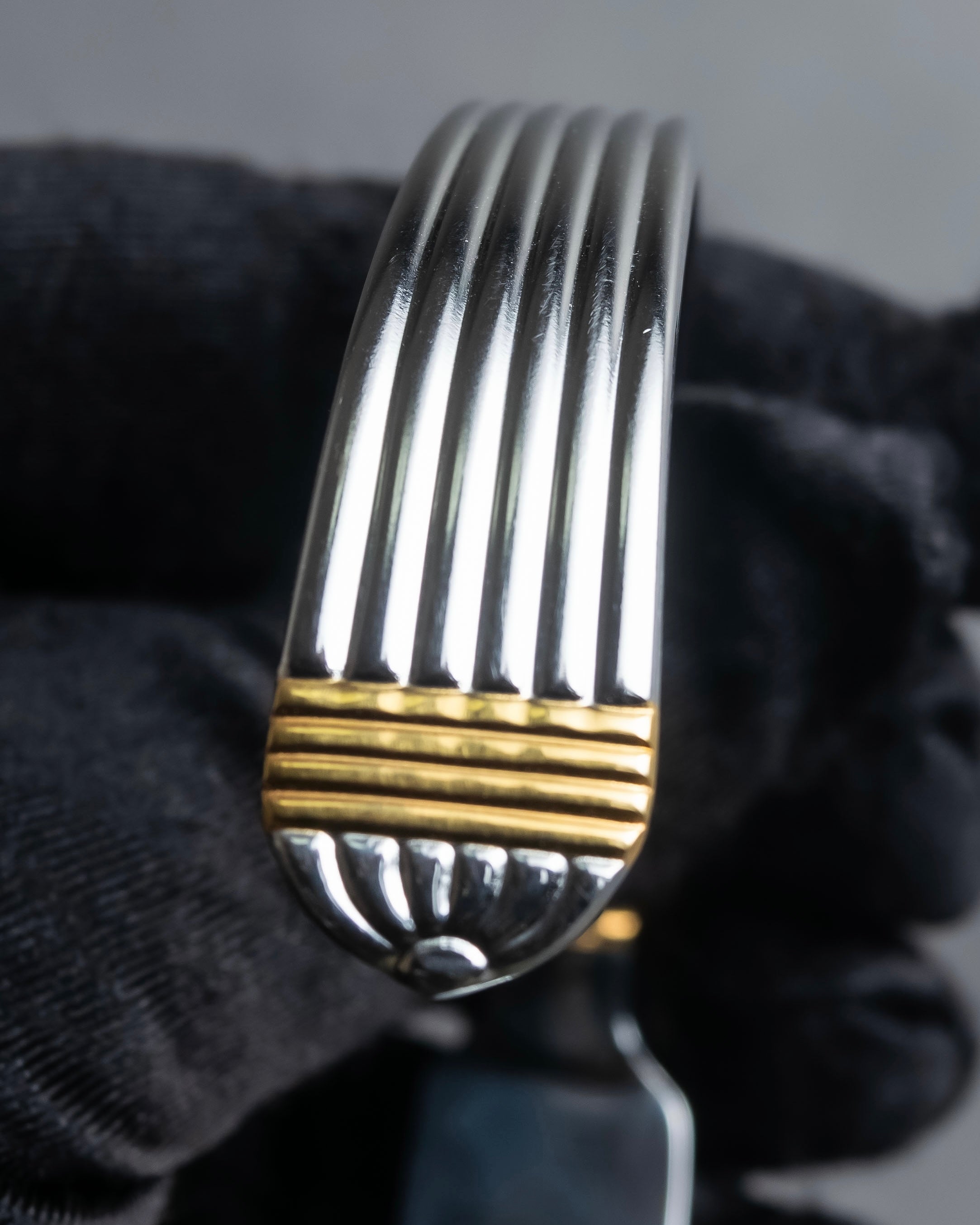 "Christian Dior" Ribbed design gold combination polished silver bangle