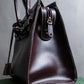 "HAMANO TOKYO" Trapezoidal shape iconic hardware leather one handle bag