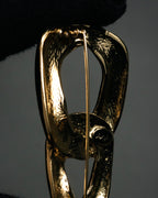 “Yves Saint Laurent” 80’s–90’s Sculptural chain motif brooch