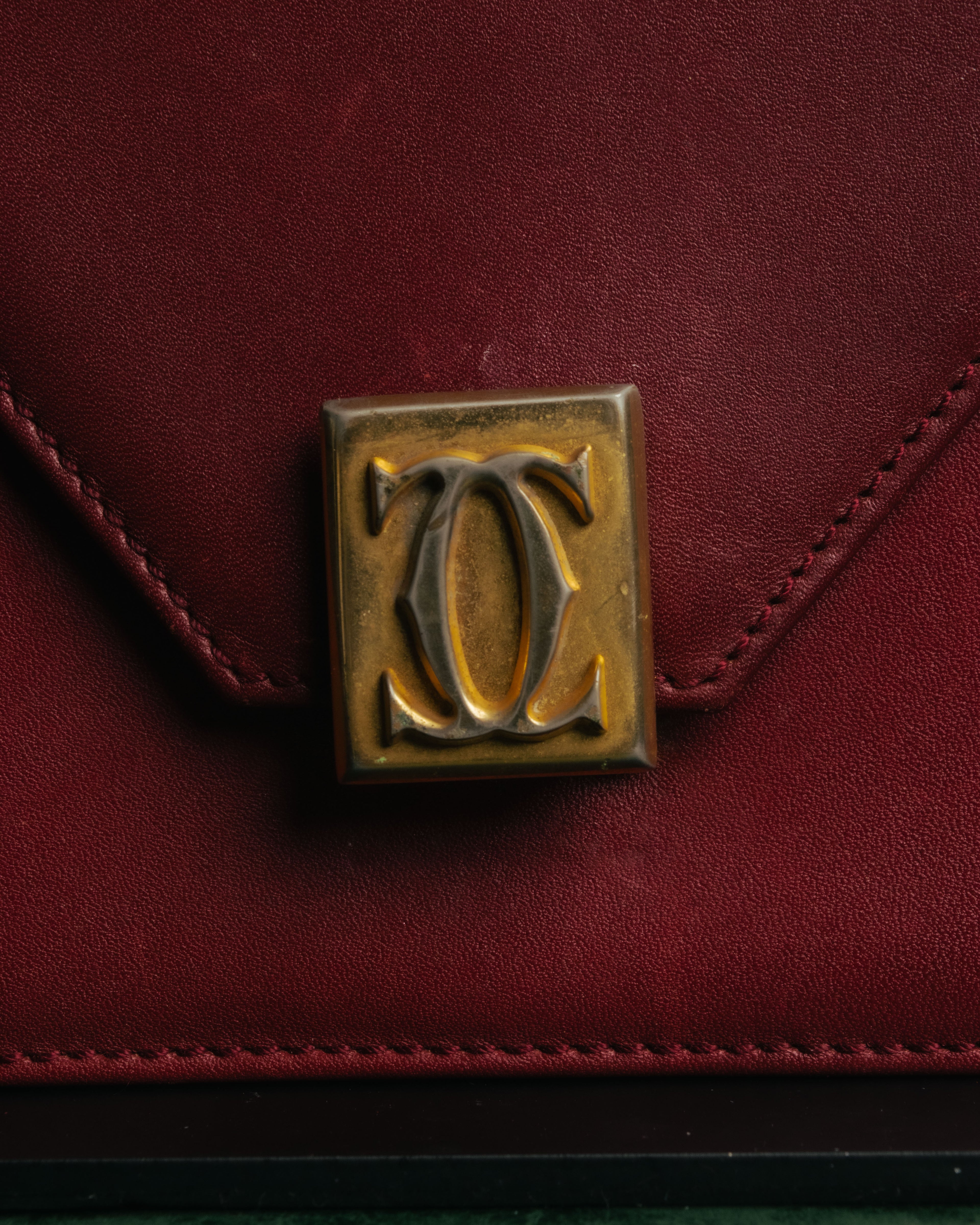 “Cartier” 80’s-90’s Must de Cartier burgundy leather shoulder bag