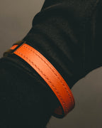 "Hermès" 00's Vibrant orange leather bracelet