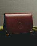 “Cartier” 90’s Must de Cartier burgundy embossed leather bifold wallet