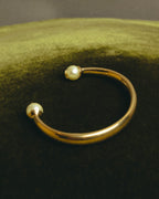 "DIOR" 10's-20's Gold tone pearl star open bangle
