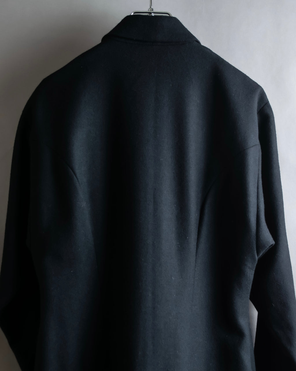 Tight-waisted wool shirt and black coat