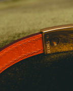 "Hermès" 00's Vibrant orange leather bracelet