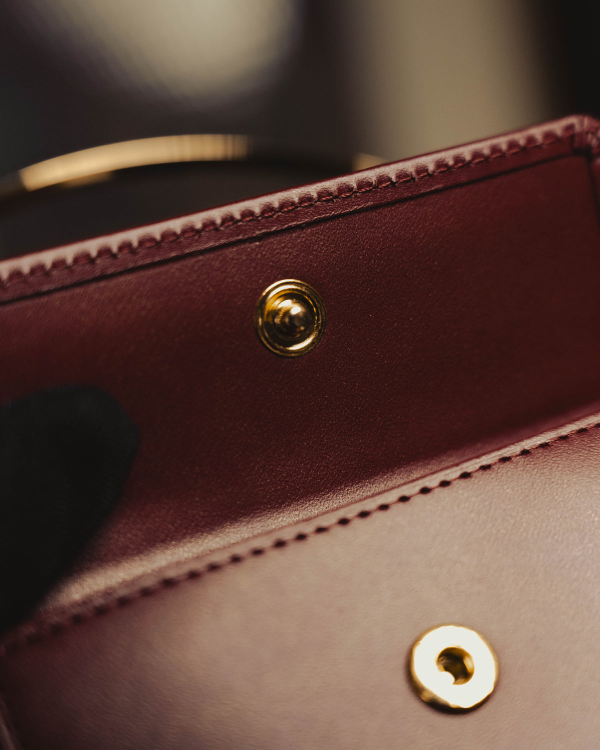 "Cartier" 80's Sculptural ring-handle leather wallet