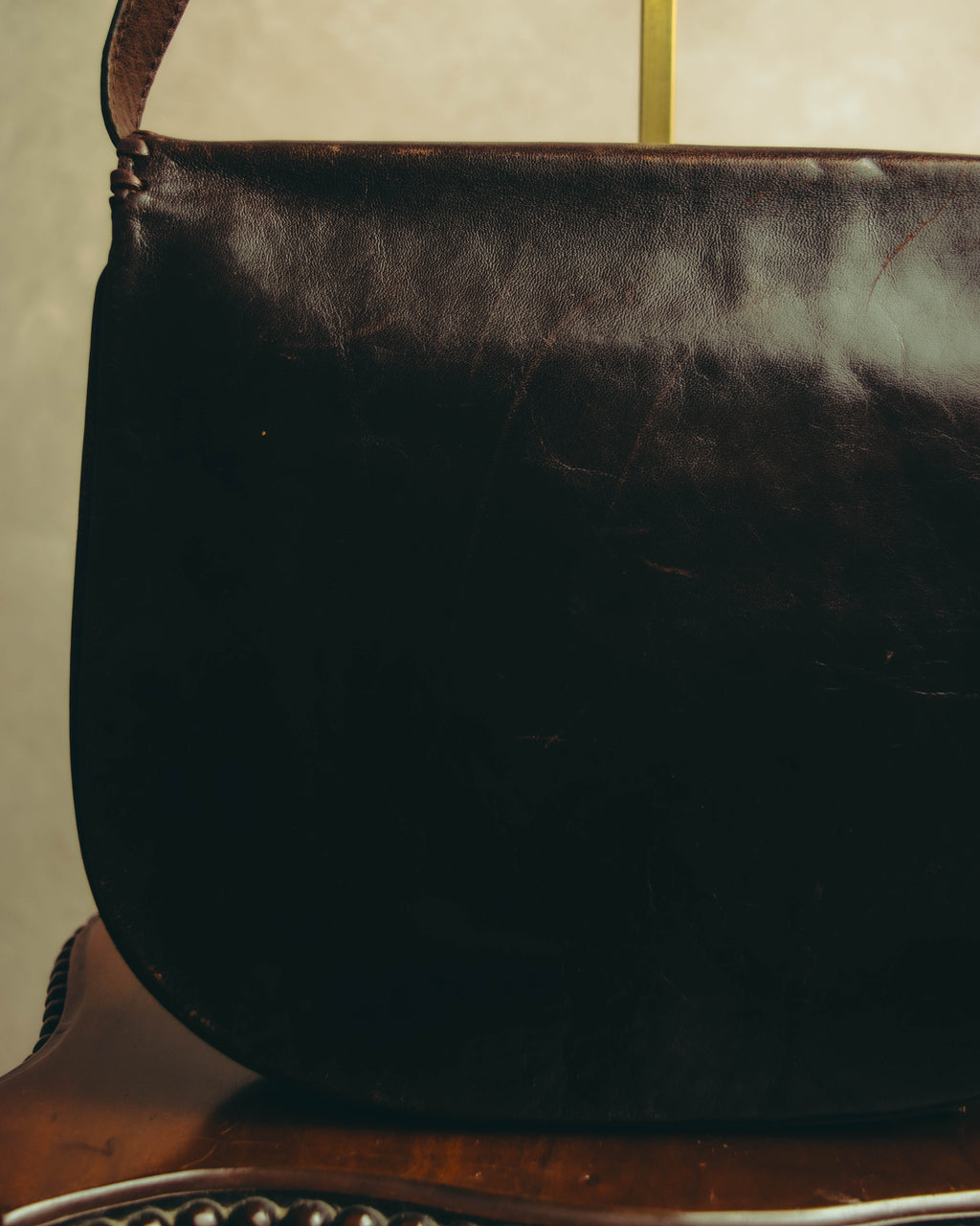 “Yves Saint Laurent” 70’s-80’s Perforated logo leather tassel shoulder bag