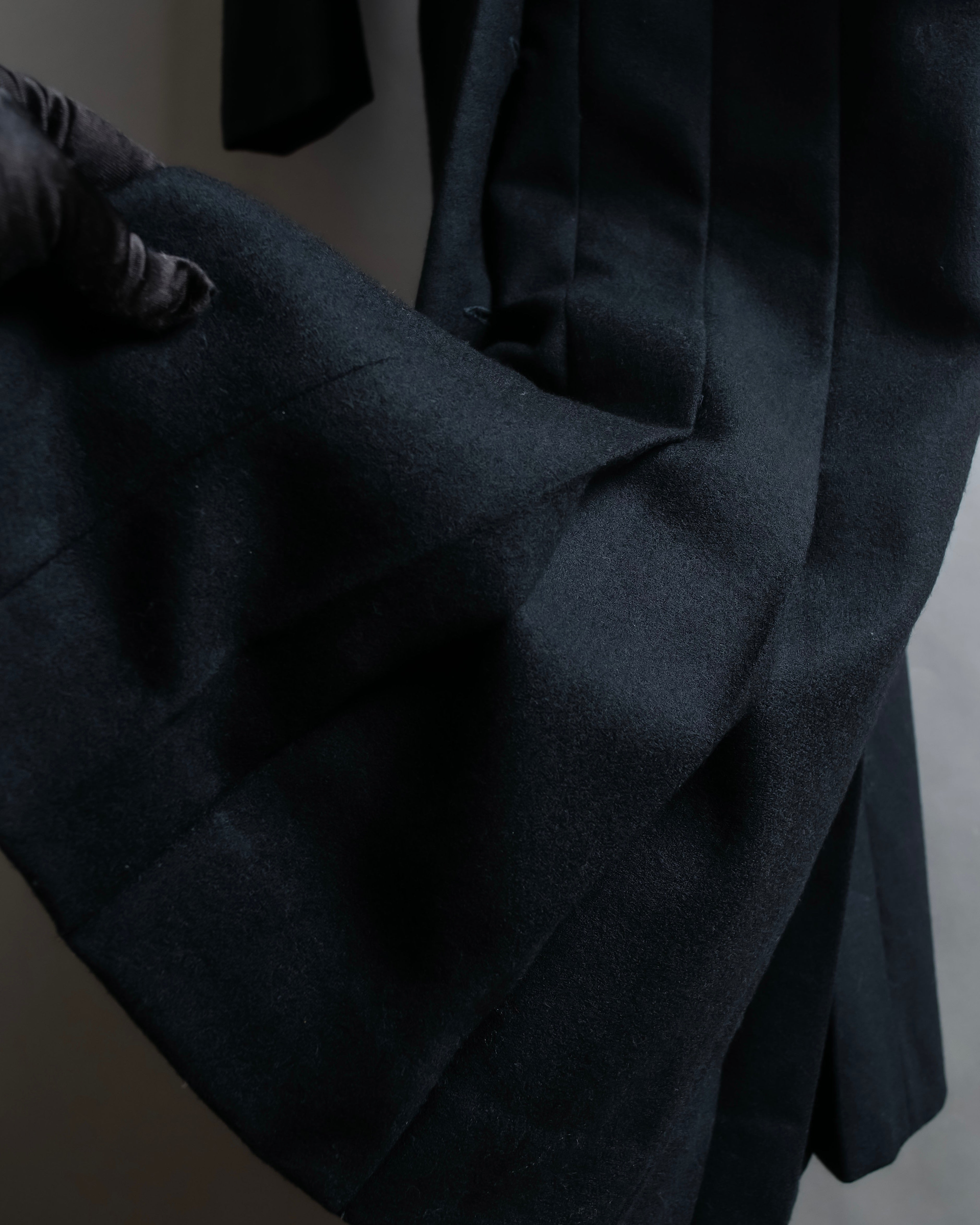 Tight-waisted wool shirt and black coat