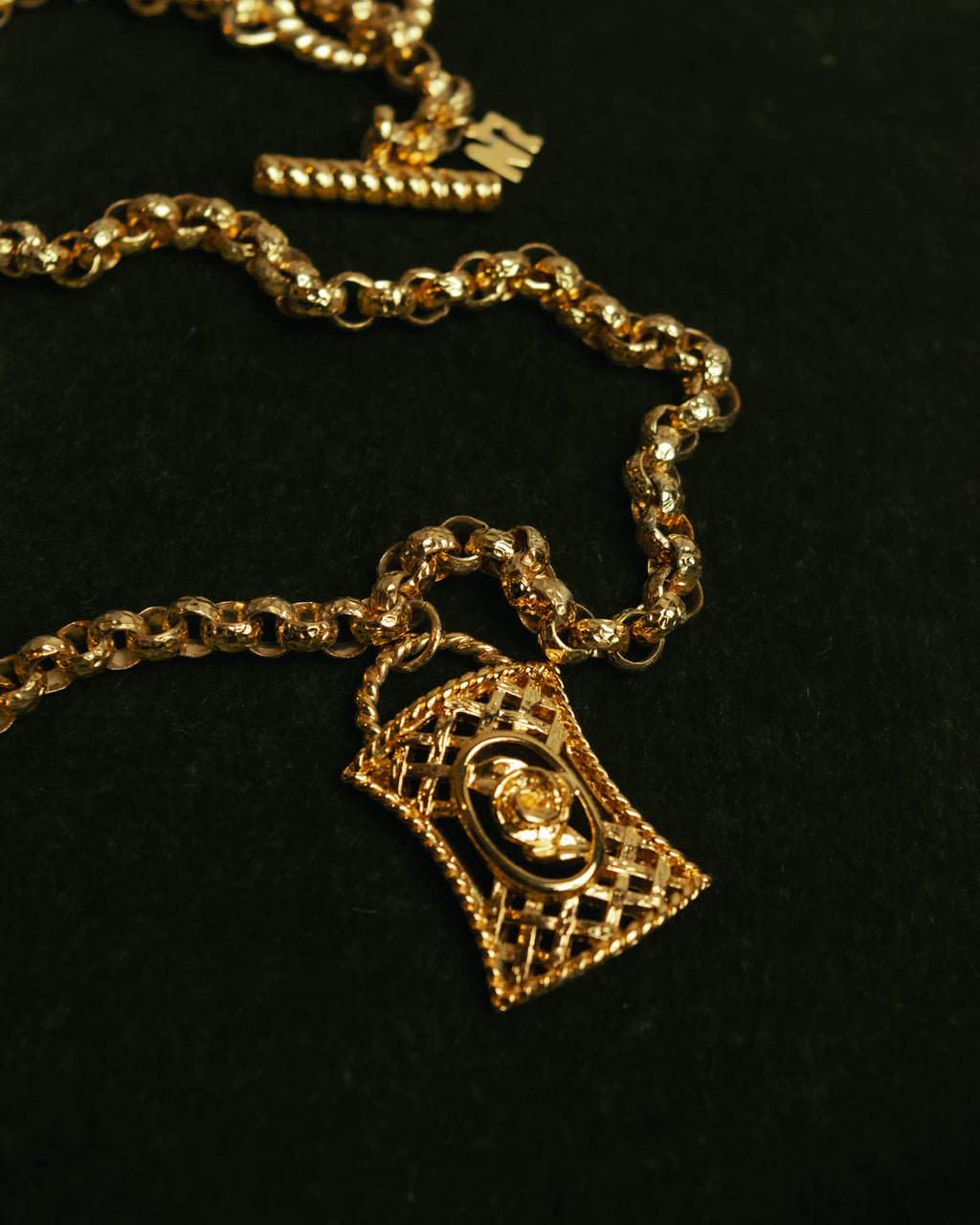 “NINA RICCI” Late 80’s-90’s gold tone openwork pendant necklace