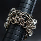 "SERGE THORAVAL" Crystal top chain braided ring