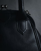 "Y’s" 22AW sculptural kiss-lock leather bag