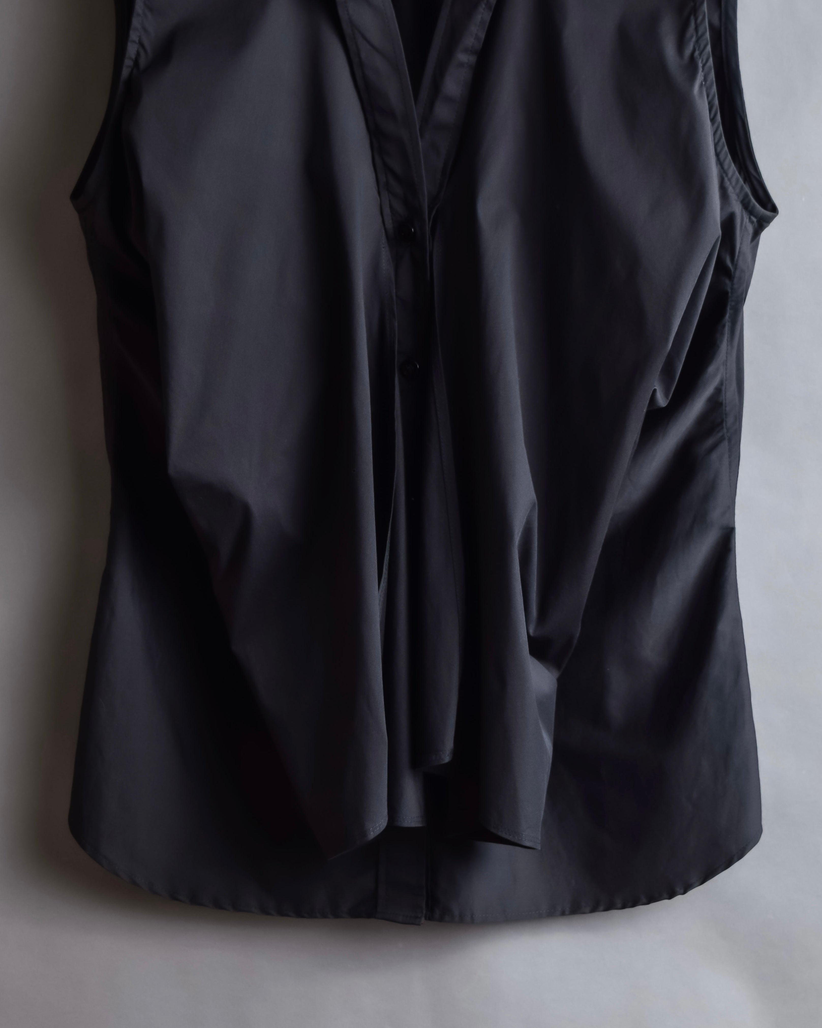 "Yves Saint Laurent Rive Gauche"
Twisted front sleeveless shirt