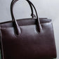 "HAMANO TOKYO" Trapezoidal shape iconic hardware leather one handle bag