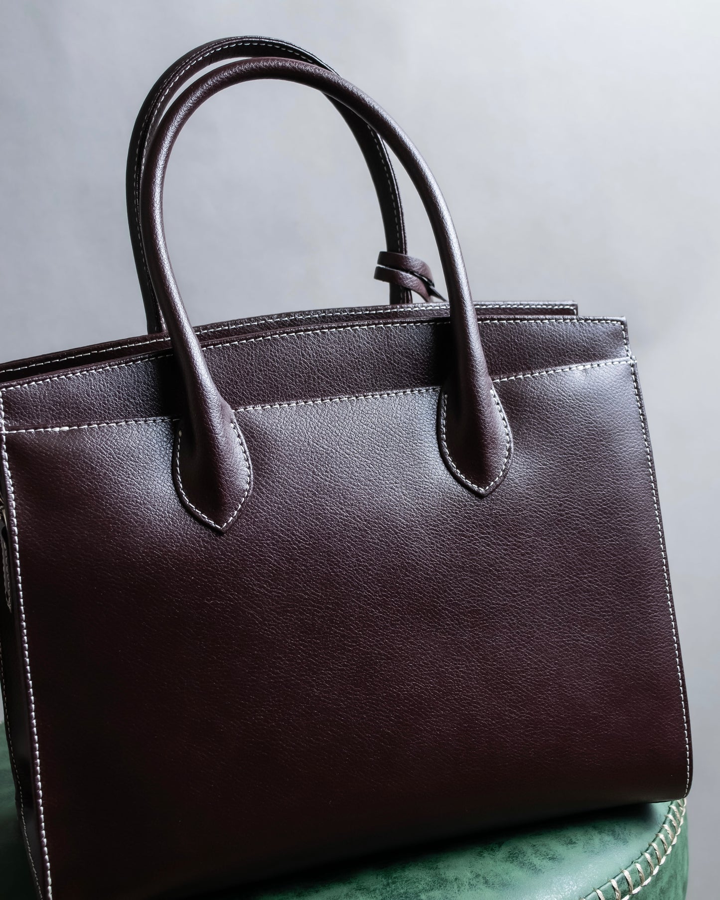 "HAMANO TOKYO" Trapezoidal shape iconic hardware leather one handle bag