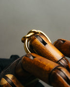 "HERMES" Sculptural gold tone knot Atame scarf ring