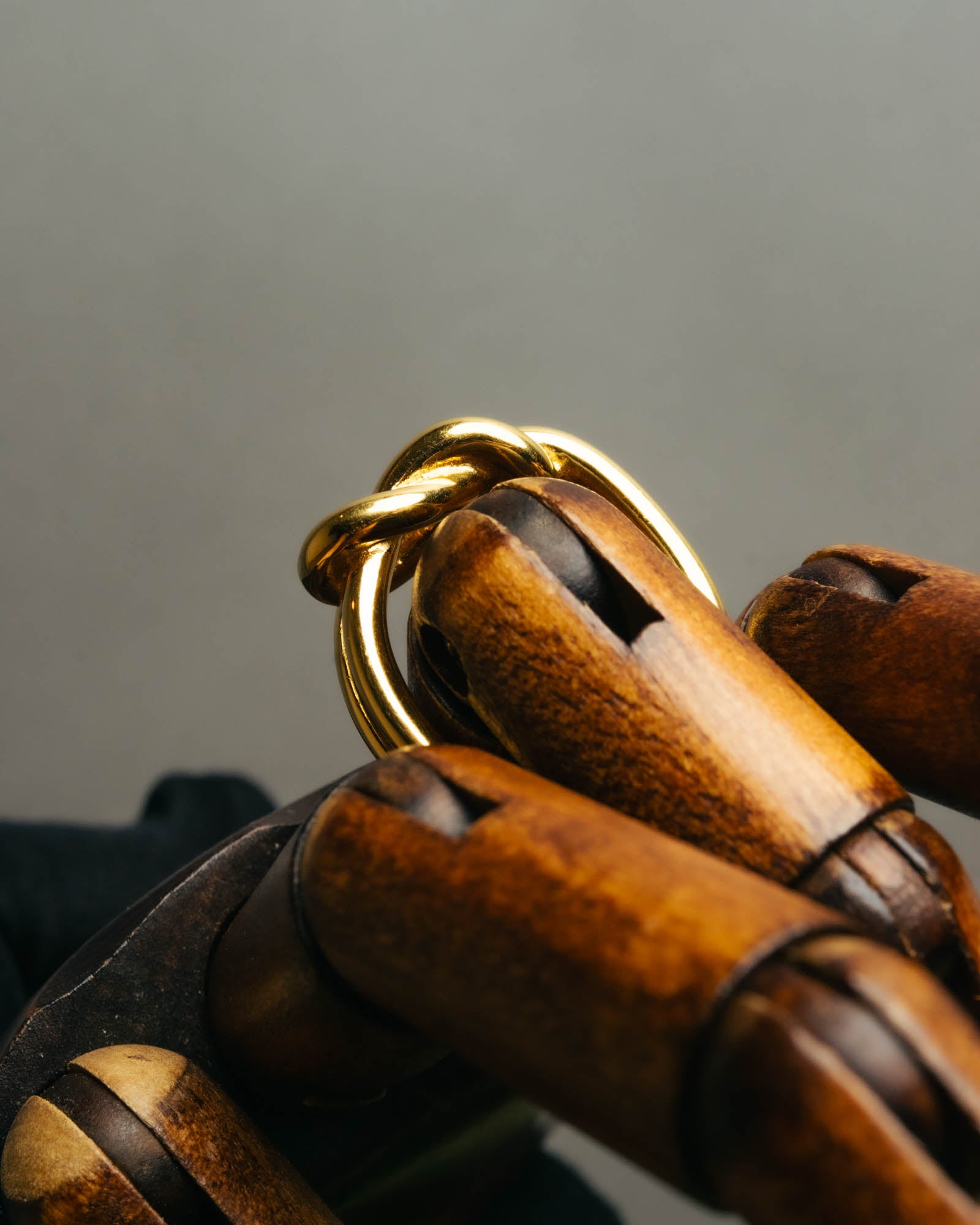 "HERMES" Sculptural gold tone knot Atame scarf ring