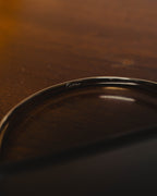 "Cartier" 80's Sculptural ring-handle leather wallet