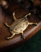 "Jerry Robertson design clock motif brooch"