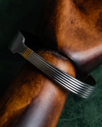 "Christian Dior" Ribbed design gold combination polished silver bangle