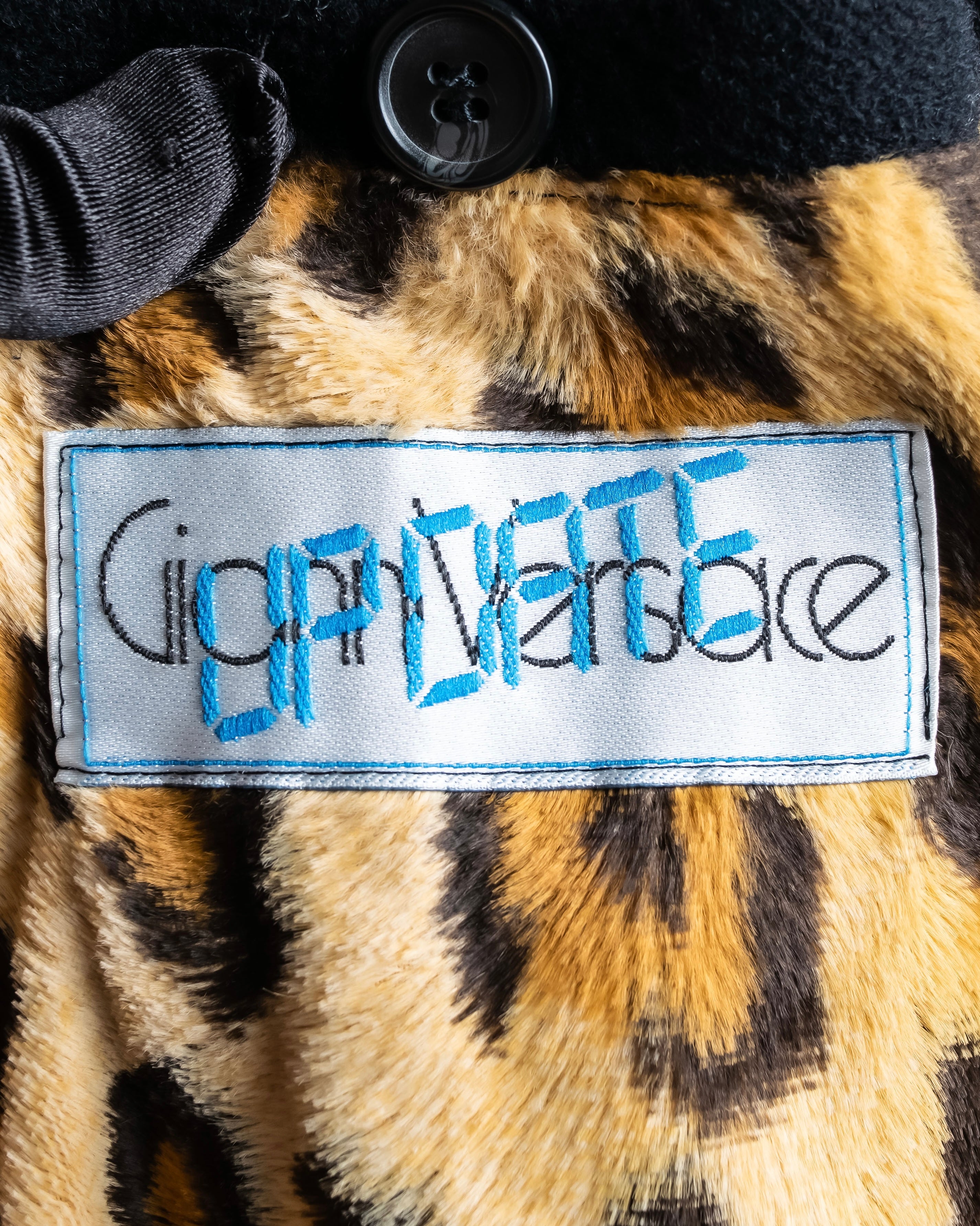 "GIANNI VERSACE UPDATE"
 Fur trimmed wool cashmere maxi double breasted coat