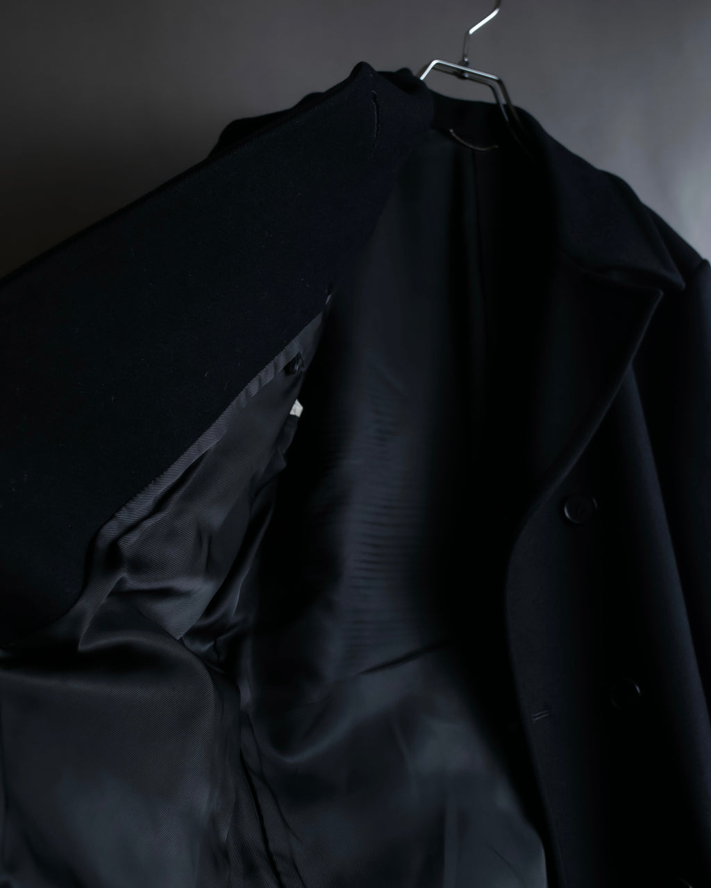 "JOHN LAWRENCE SULLIVAN"
 Large lapel double-breasted mid length coat