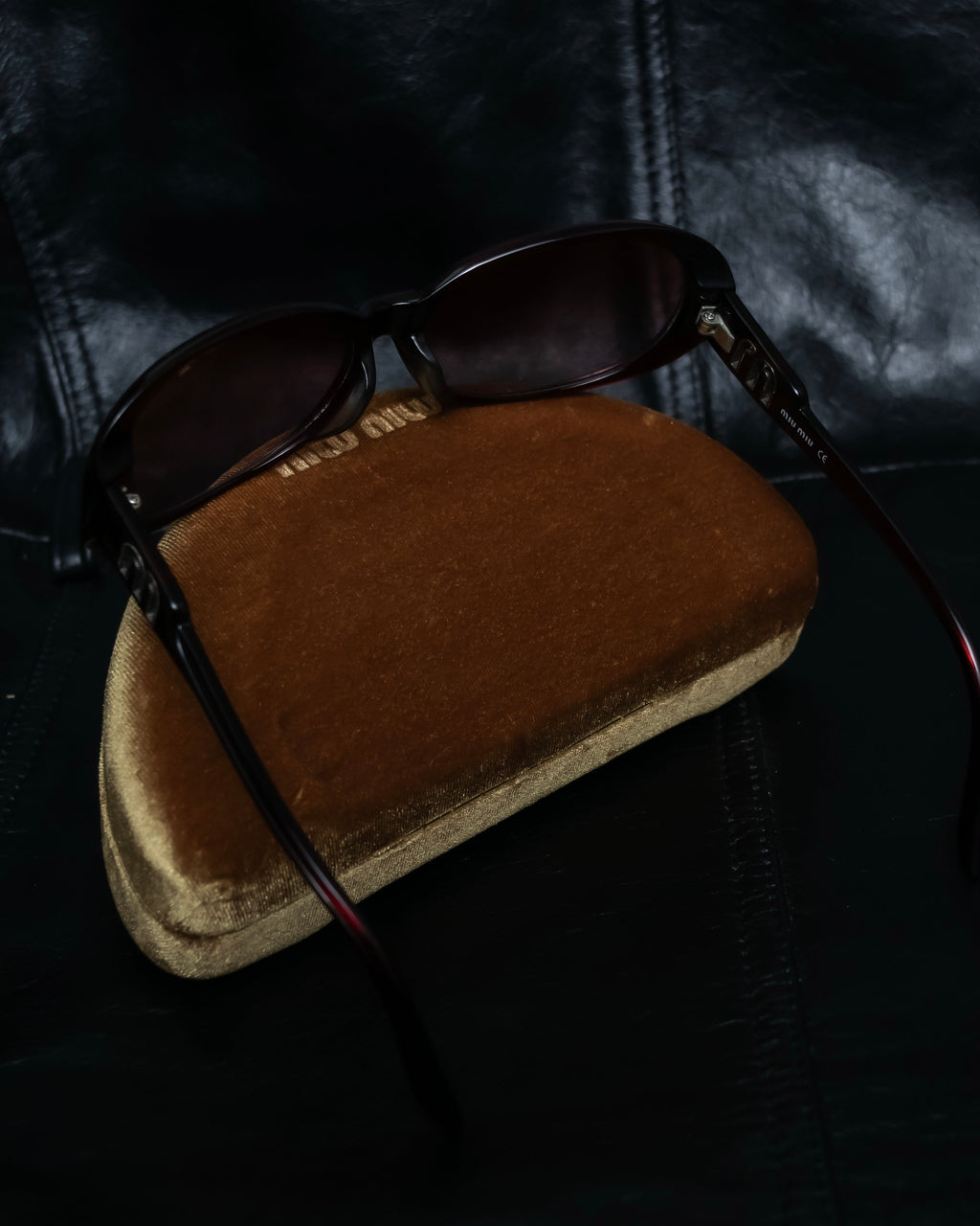 "Miu Miu" reddish brown sporty sunglasses