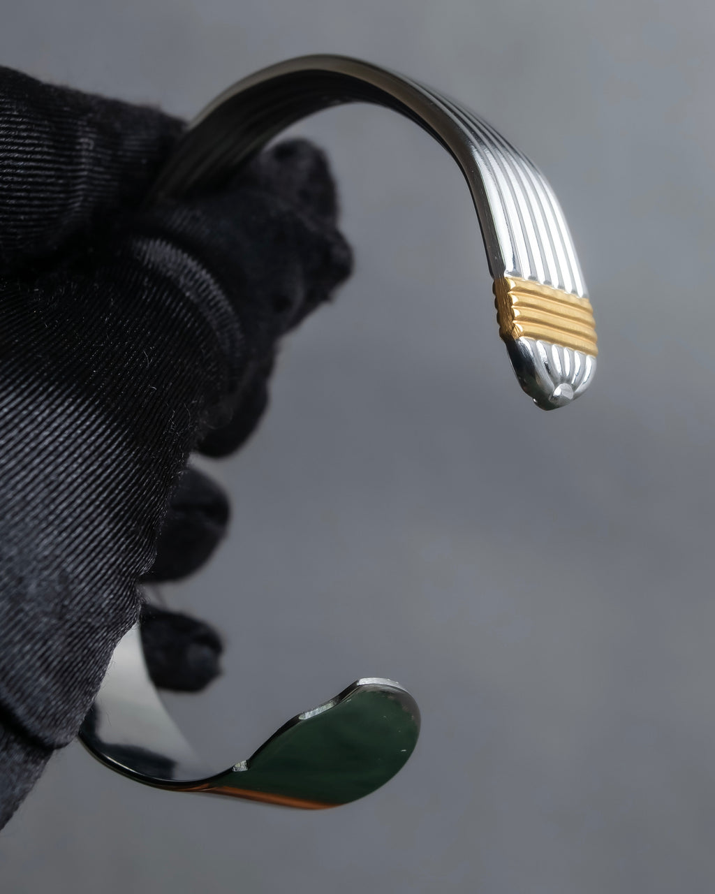 "Christian Dior" Ribbed design gold combination polished silver bangle