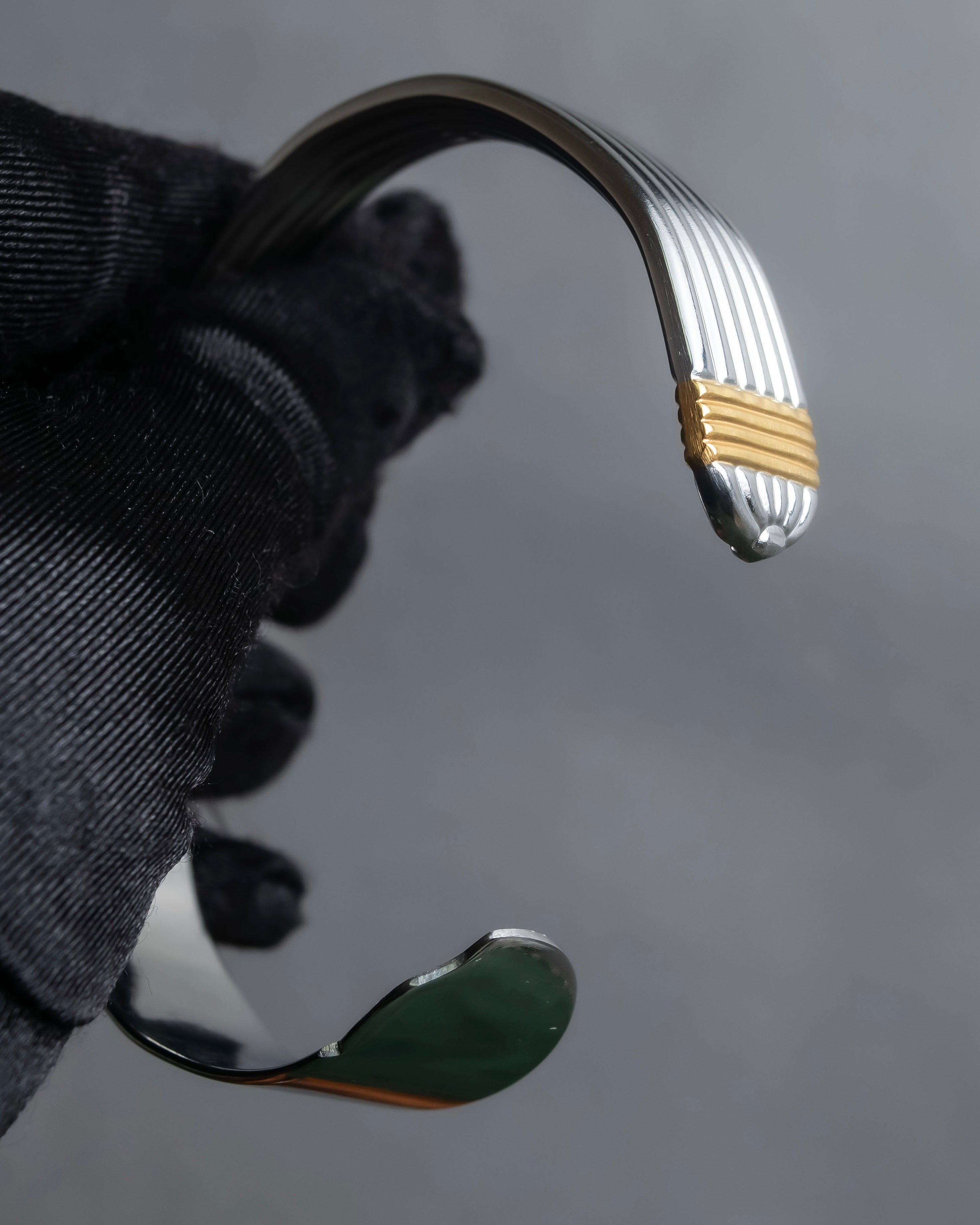 "Christian Dior" Ribbed design gold combination polished silver bangle