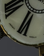 "Jerry Robertson design clock motif brooch"