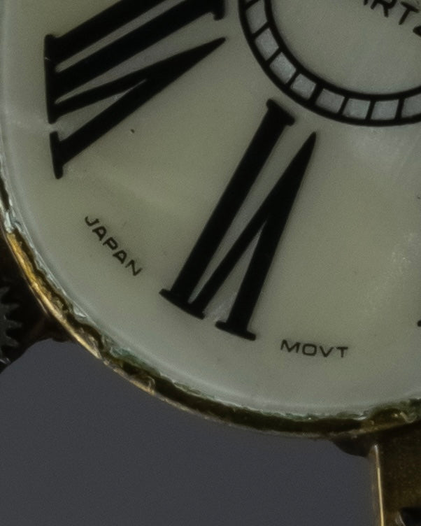 "Jerry Robertson design clock motif brooch"