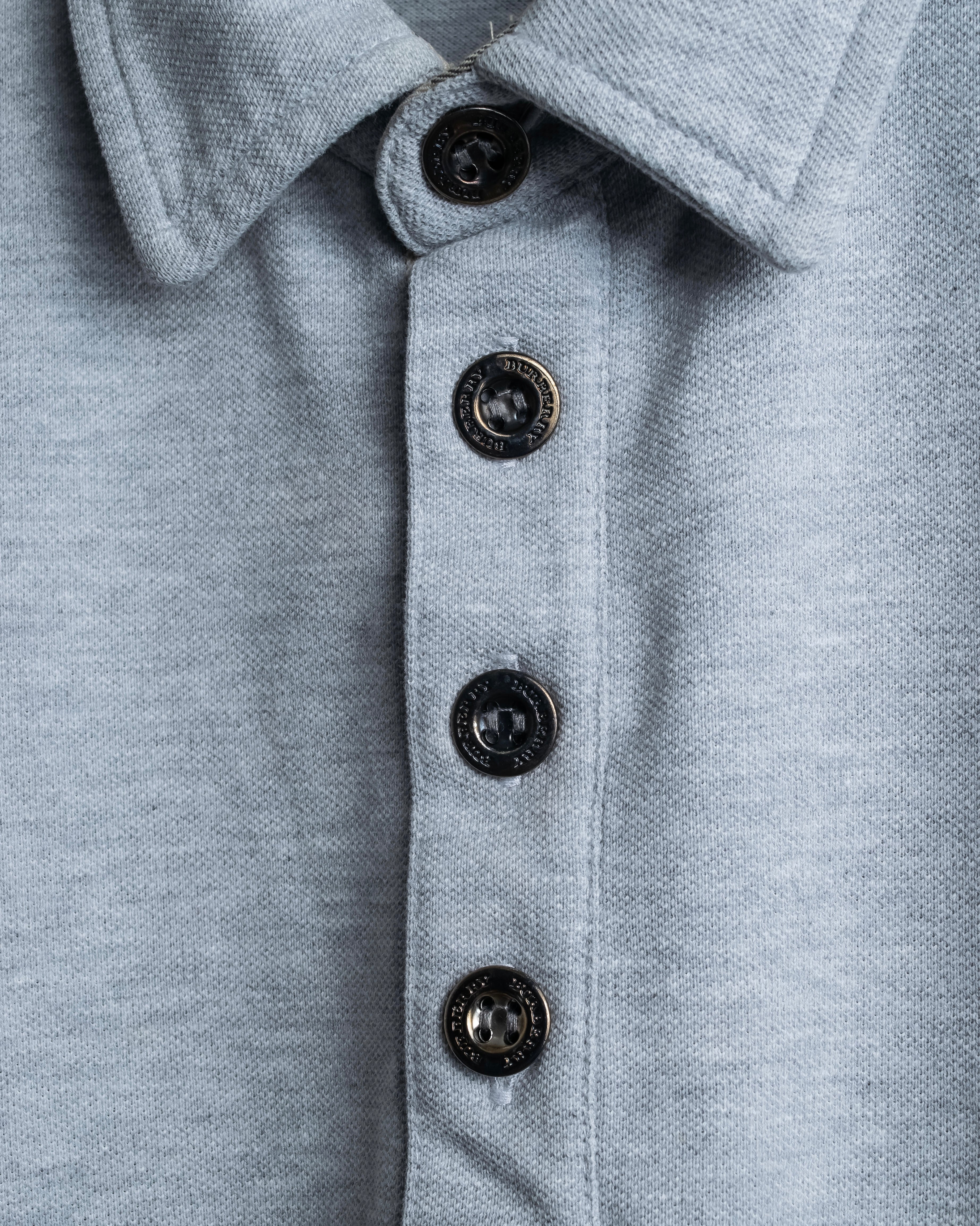 "BURBERRY" Knight logo engraved metal button polo shirt