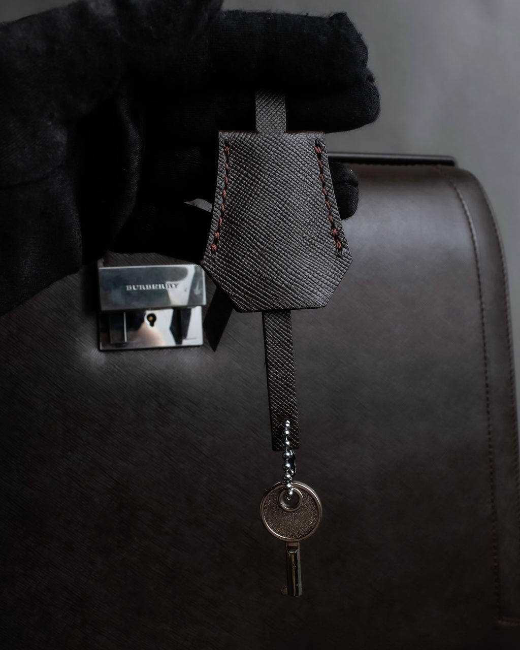 "BURBERRY" Metal belt design embossed PVC briefcase