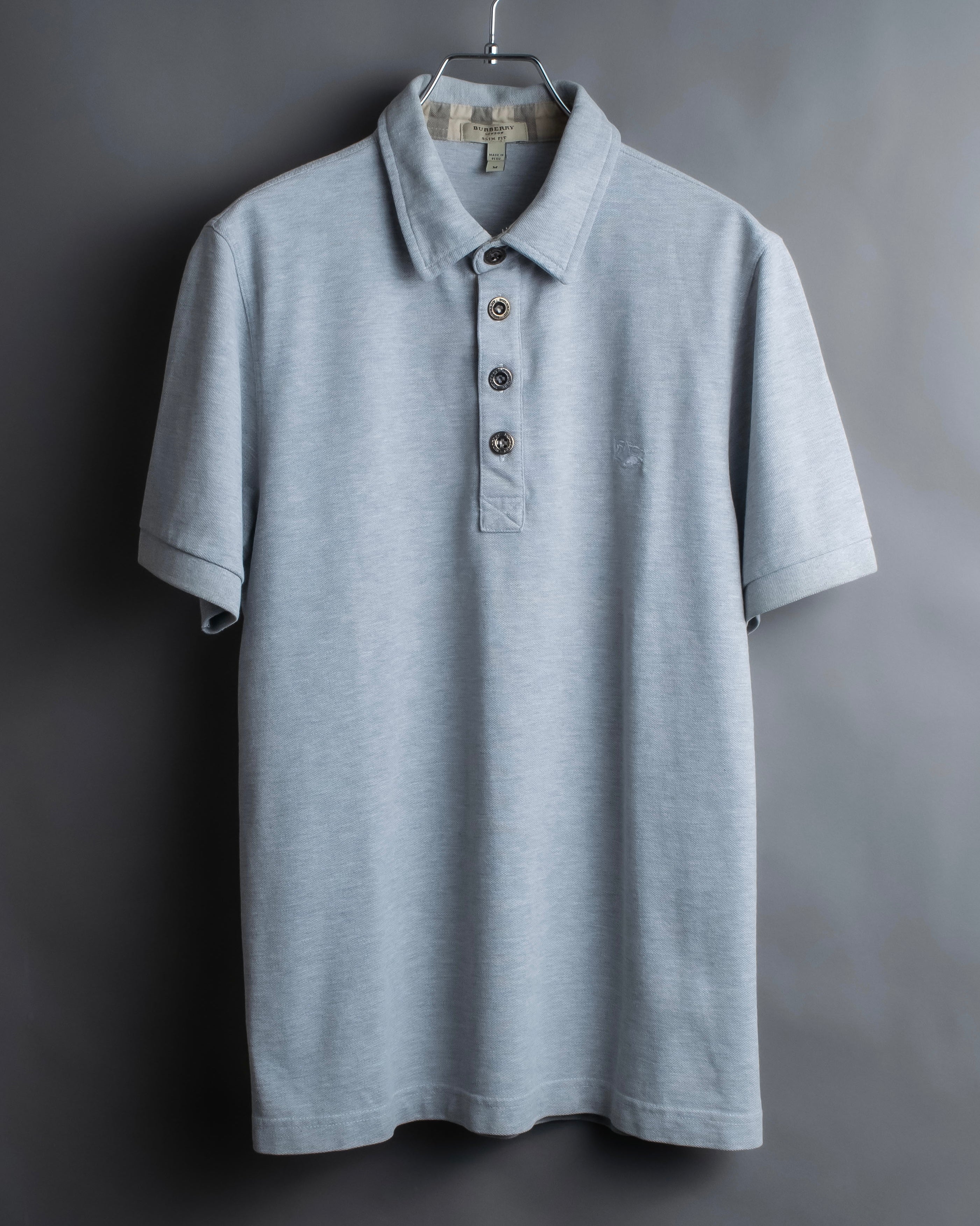 "BURBERRY" Knight logo engraved metal button polo shirt