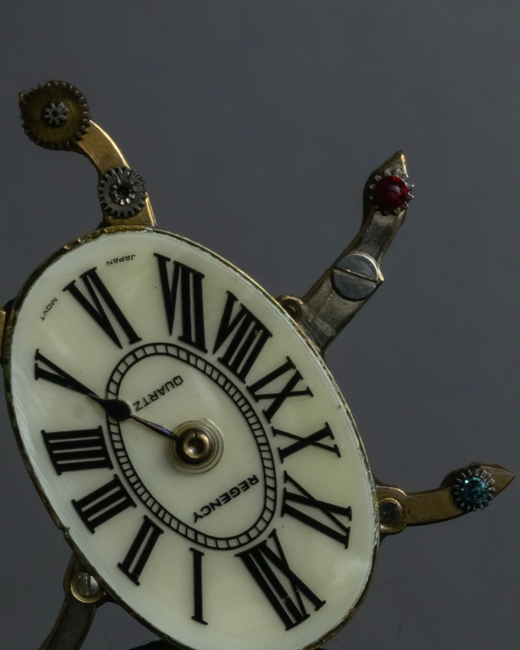 "Jerry Robertson design clock motif brooch"