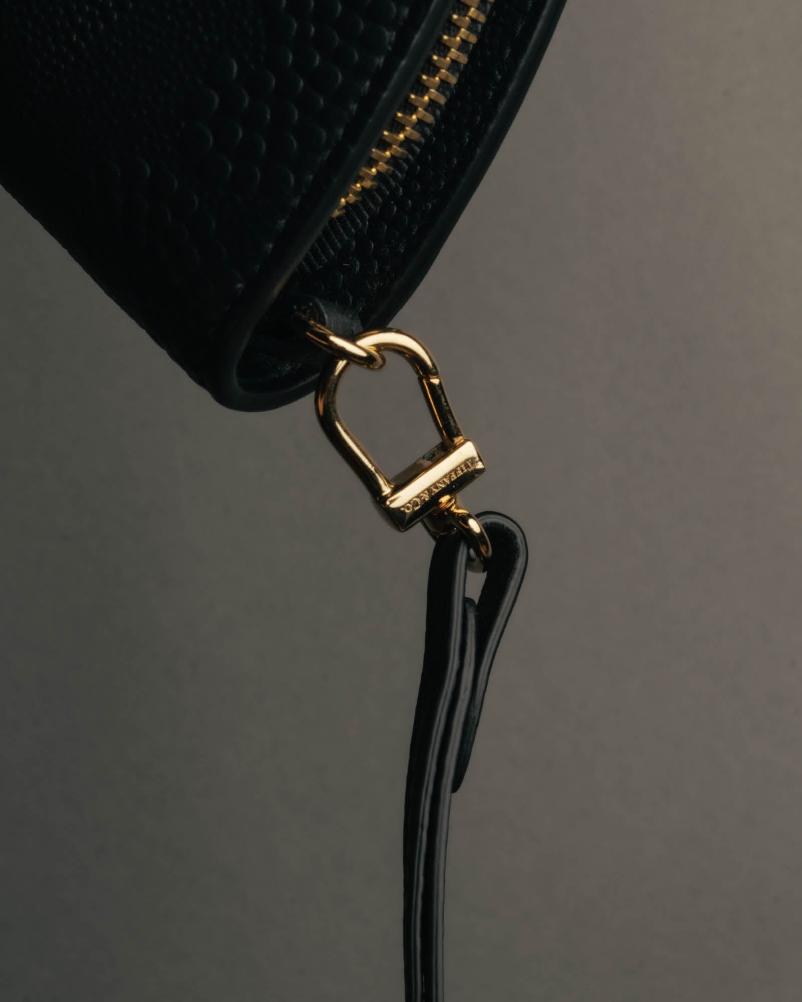 "Tiffany & Co." 10's-20's Embossed leather wristlet wallet