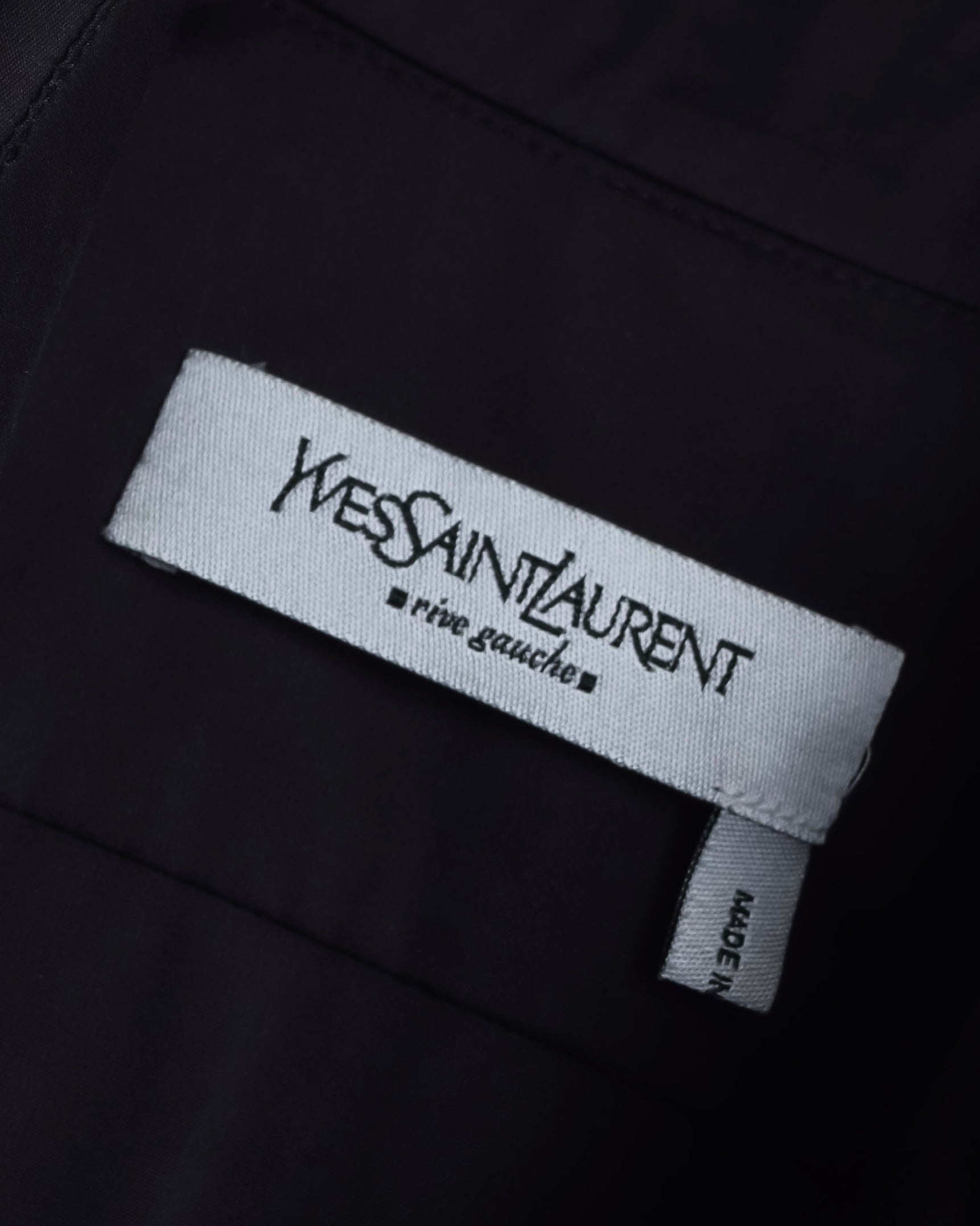 "Yves Saint Laurent Rive Gauche"
Twisted front sleeveless shirt