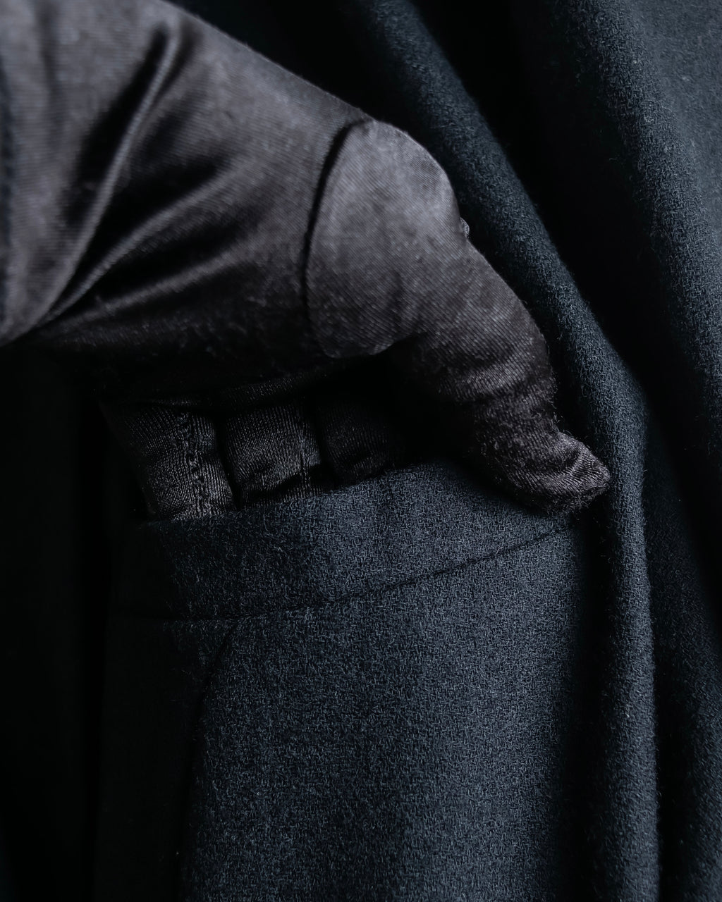 Tight-waisted wool shirt and black coat